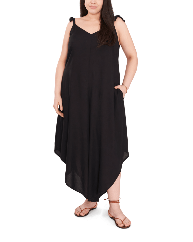Front of a model wearing a size 1X Ruby Tie Shoulder Jumpsuit in RICH BLACK by Vince Camuto. | dia_product_style_image_id:261979